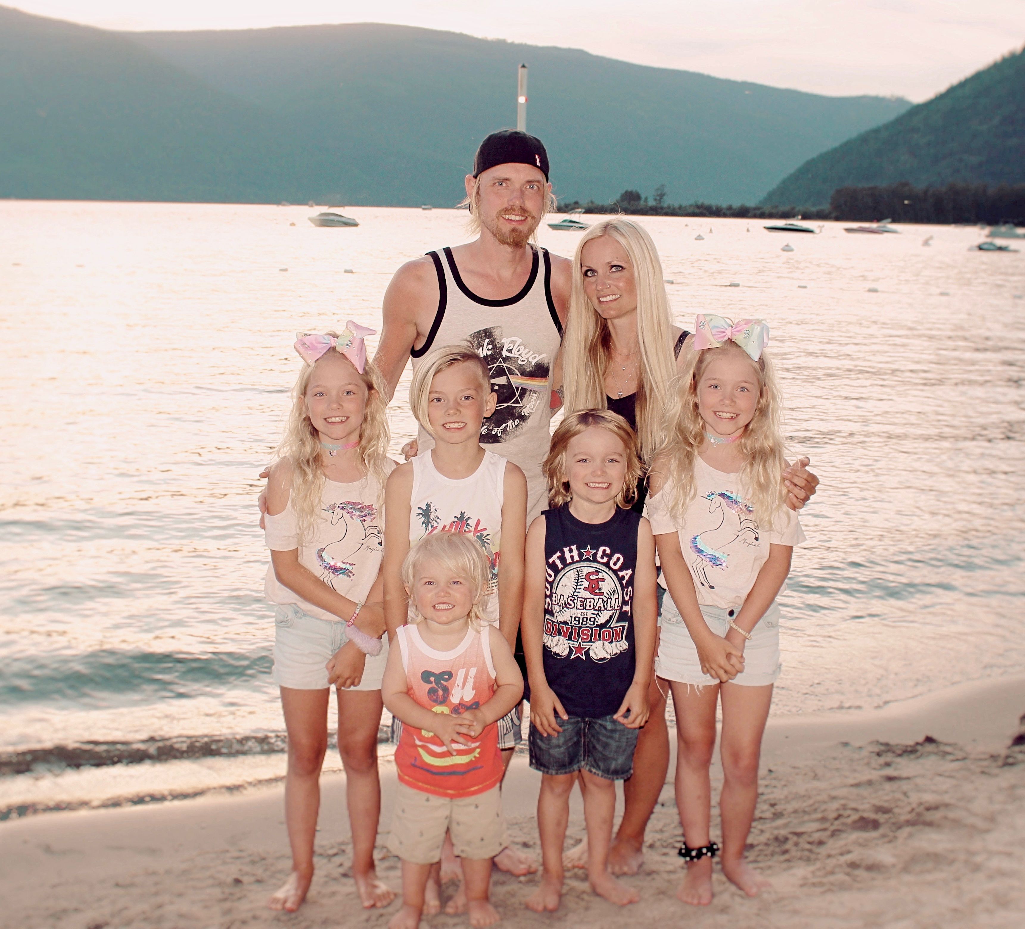 Christian couple at the beach with their 5 beautiful children