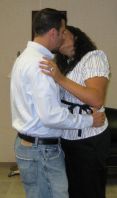 A Christian couple kiss tenderly indoors