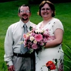 Midwest Christian singles find love and pose together with wedding flowers on the grass