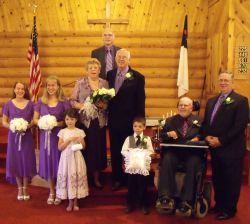 Wedding for widowed Christians at a church surrounded by flower girls