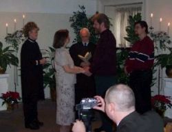 A Christian couple exchange their vows in front of family and friends