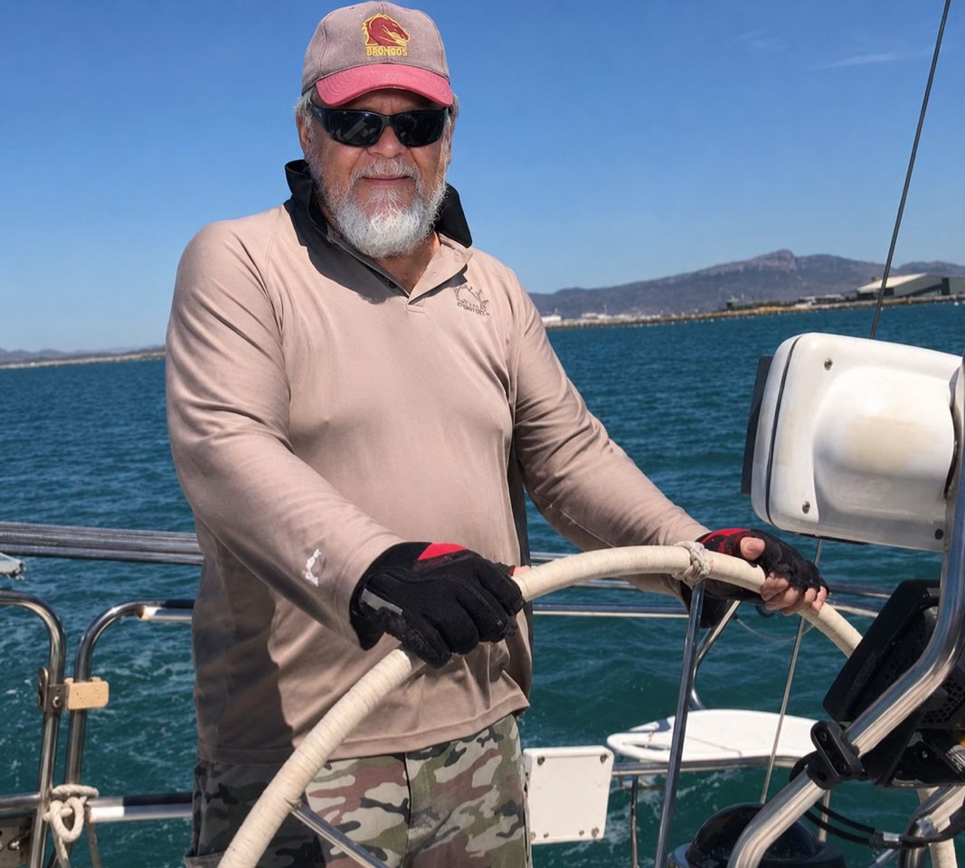 A new yacht owner stands at the helm