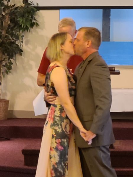 Kiss at the altar for Christian couple