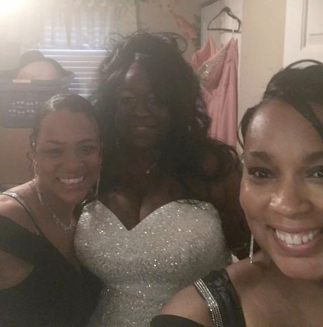 A radiant bride takes a selfie with her bridesmaids