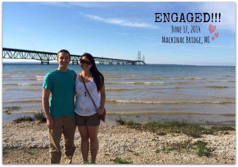 Newly engaged Christian singles stand at shores of Lake Michigan while smiling