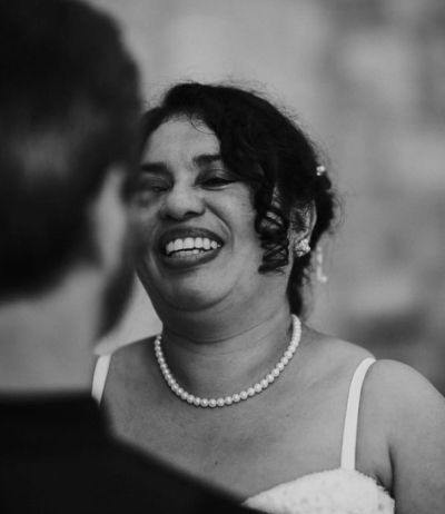 Laughter and joy from bride as she looks at her husband