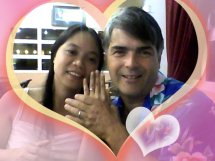 A heart shaped filter frames this selfie of newly married Christians showing off their rings
