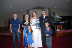 The whole family celebrate Danielle and Sam's wedding in the church