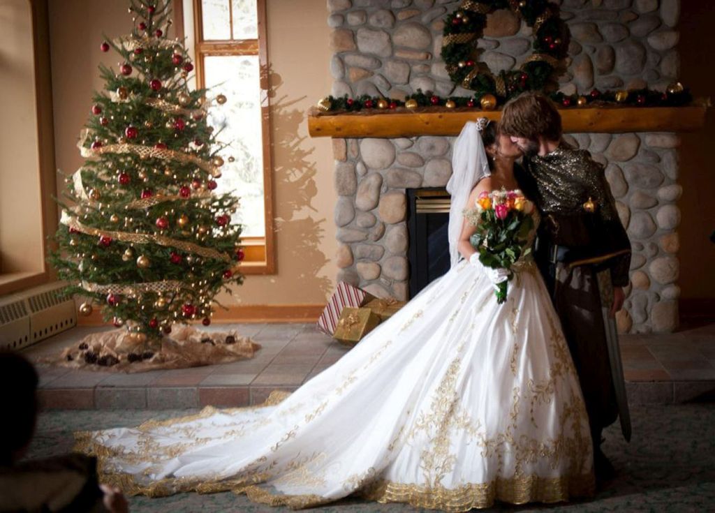 A bearded knight weds his princess in front of a fireplace.