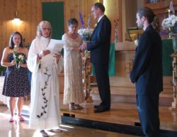Christian couple receive their blessing at the altar