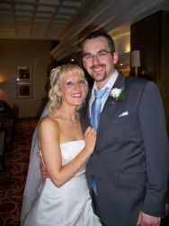 UK single Christians no more. A happy man and his new wife hug while smiling