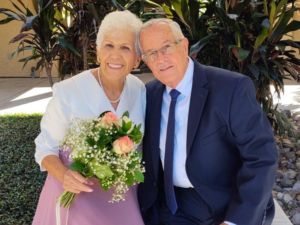 An elderly Christian woman beams with joy after marrying the man of her dreams