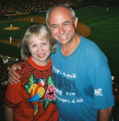 Former Christian singles look very happy and comfortable together at a baseball game