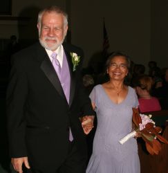 Senior interracial Christians are very much in love as they walk hand in hand