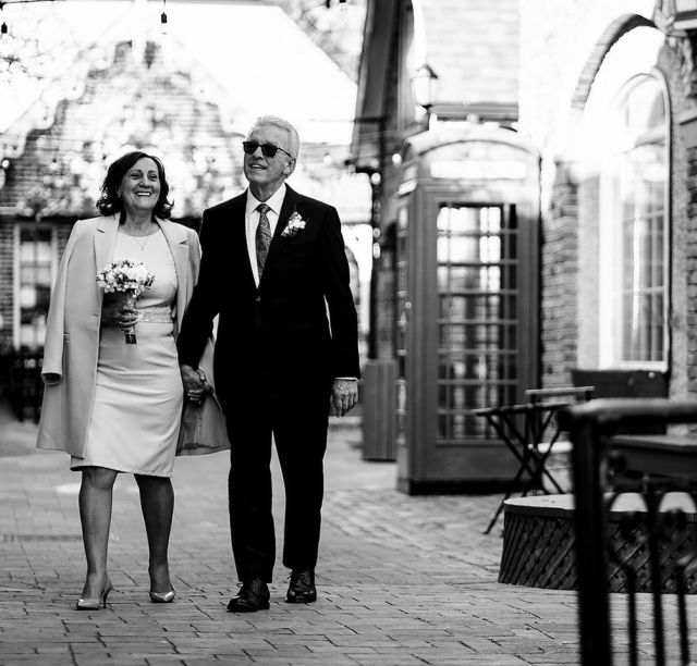 Black and White photo of newly married couple in London street