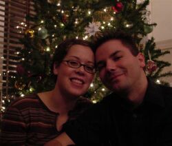 Ontario Christian singles in love in front of Christmas tree
