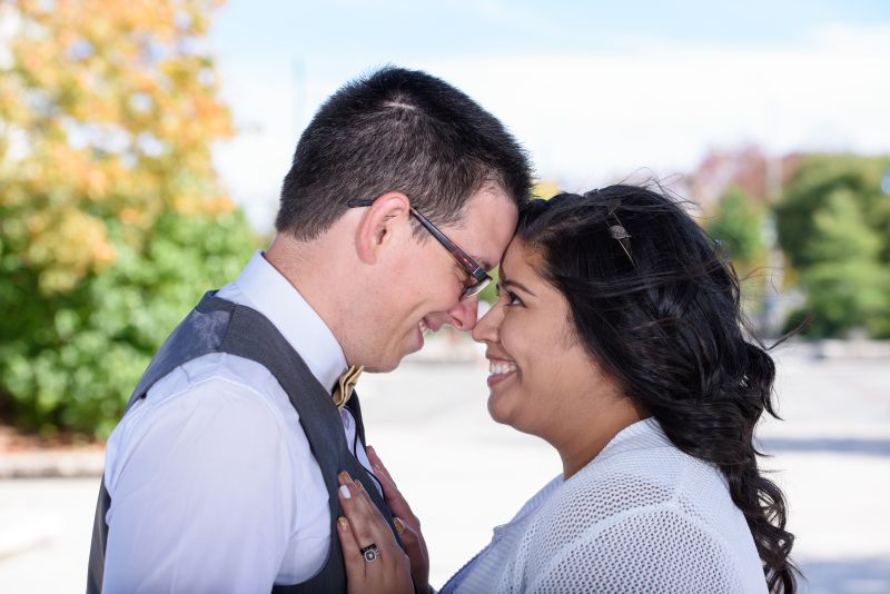 Christian newlyweds from Ontario snuggle and prepare to kiss