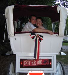 Christians ride in Wedding Carriage which says Get Er Did