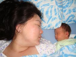 Sleeping mother and her new baby for a Christian couple