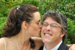 Wisconsin marriage made in heaven. A newly married woman kisses her overjoyed husband