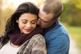 A beautiful Christian single woman from Ontario is hugged affectionately by a devoted man