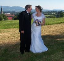 Beautiful Poland in the background as a married couple prepare to kiss