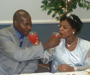 Newly weds try giving each other drinks and try not to laugh