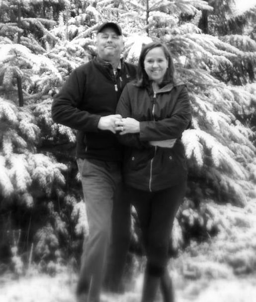 Former Christian singles holding hands and standing in front of forest in winter as they celebrate 11 years