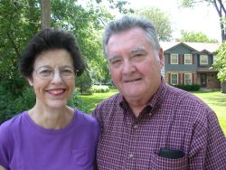 A beautiful country home behind two senior Christians in love
