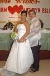 An American husband hugs his new Philippines wife after marrying