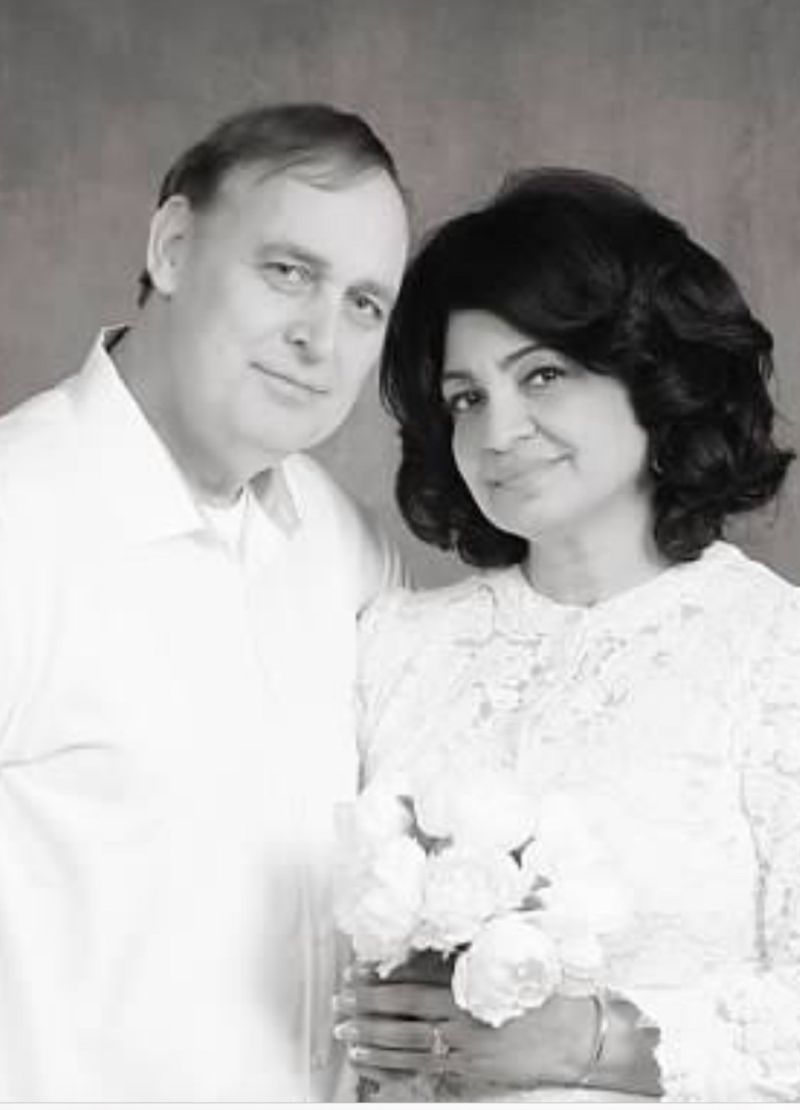 A black and white photo of a happy Christian couple posing side by side