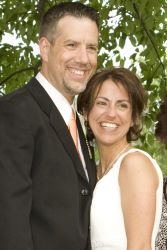 Beautiful Christian couple from New York stand next to each other and smile ear to ear