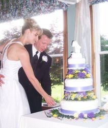 Happily married Christians from PA cut a beautiful wedding cake