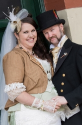 Joyful Australian Christians pose together, dressed in Victorian steampunk wedding clothes
