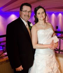 Ontario newlyweds stand side by side on the dance floor