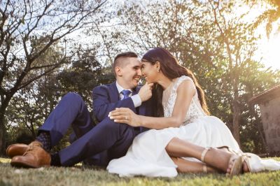 Smiling Christian couple on grass in tender moment