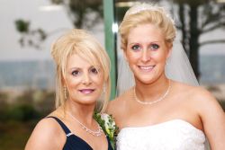 Proud Christian mother of the bride with her daughter