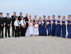 Huge wedding party shown on the beach