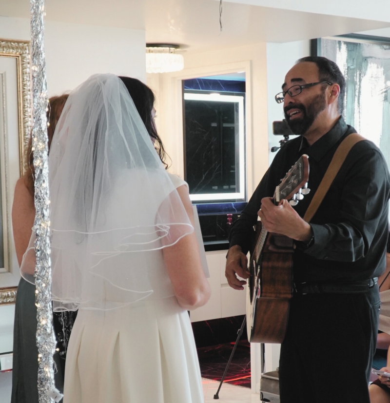 A Jewish believer plays guitar and sings his vows to his new wife
