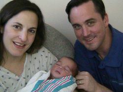 Bible believing Christians look very proud as they hold their newborn baby