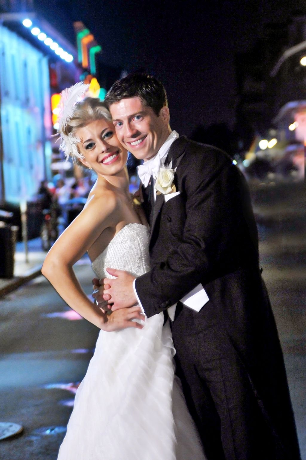 Stunning Christian couple hug in a street after marrying