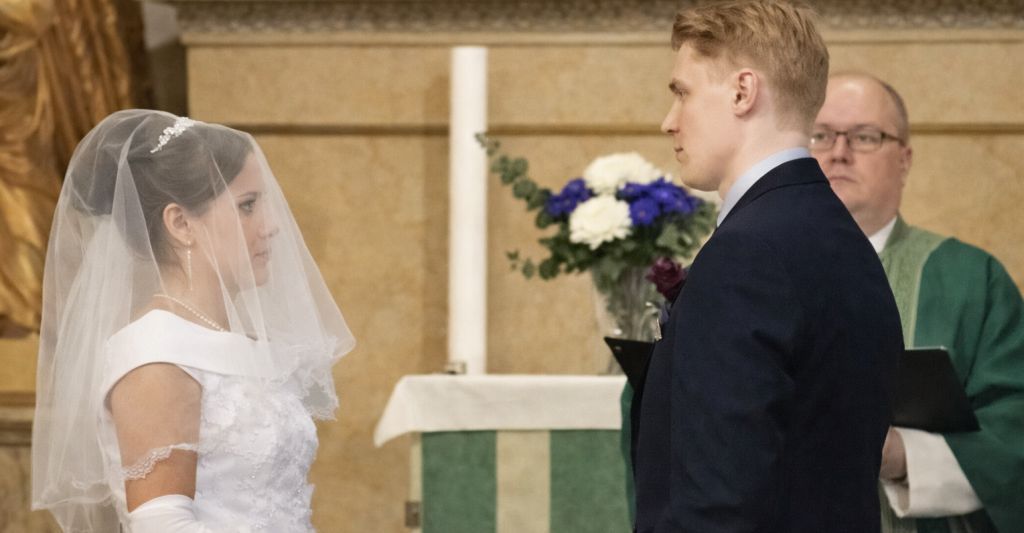 Finnish Christian singles find love at altar, with bride in veil at church