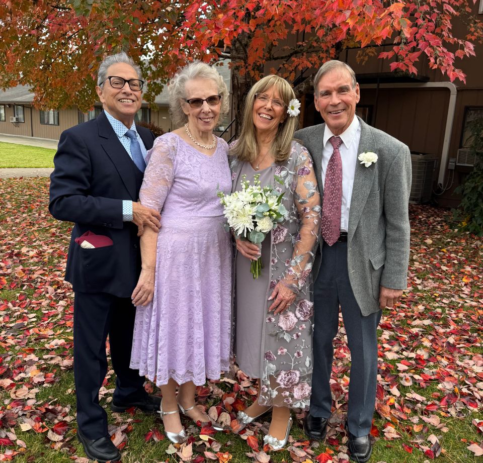 Senior Christians celebrate their marriage with friends, on an Autumn day outside