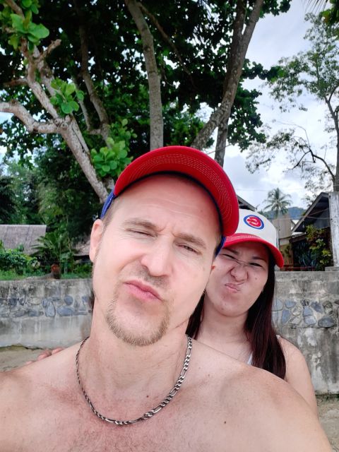 Silly selfie for young Christian couple at the beach