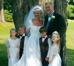Senior Christians marry and stand next to grandchildren
