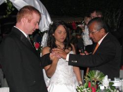The pastor prays over the marriage of these former Christian singles