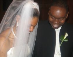 Newly married Christians laugh together in a touching moment