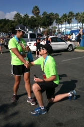 Christian single man from California proposes on bent knee before a marathon
