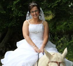 Fairy tale wedding for Irish Christian woman who is seated on a horse
