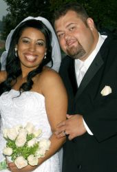 Cute Christian couple smile together on their wedding day